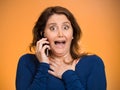 Shocked business woman funny looking employee talking on cell ph Royalty Free Stock Photo