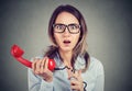 Shocked business woman receiving bad news over the telephone Royalty Free Stock Photo