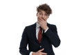 Shocked businessman gasping and covering his mouth