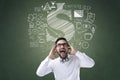 Shocked businessman with icons Royalty Free Stock Photo