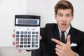 Shocked Businessman Looking At Calculator Royalty Free Stock Photo