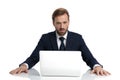 Shocked businessman in navy blue suit reading emails Royalty Free Stock Photo