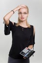 Shocked businesswoman with calculator