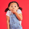 Shocked child, portrait and hand on mouth in secret, oops and mistake facial expression on isolated red background. Kid