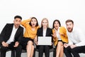 Shocked colleagues sitting in office using laptop computer. Royalty Free Stock Photo