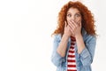 Shocked concerned young redhead female friend reacting shocking terrifying news gasping scared close mouth hands wide