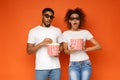 Shocked couple 3d glasses watching movie with popcorn Royalty Free Stock Photo