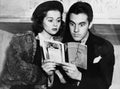 Shocked couple reading together Royalty Free Stock Photo