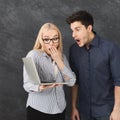 Shocked couple using laptop at studio Royalty Free Stock Photo