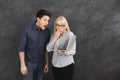 Shocked couple using laptop at studio Royalty Free Stock Photo