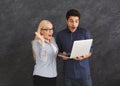 Shocked couple using laptop at studio Royalty Free Stock Photo