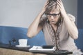 Shocked crazy woman checking expensive electricity and household bills sitting on sofa in the living room at home. finance interio Royalty Free Stock Photo