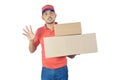 Shocked delivery man holding carton box in uniform