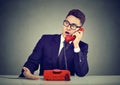 Shocked young man receiving bad news over the phone Royalty Free Stock Photo