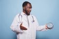 Shocked doctor looking at clock Royalty Free Stock Photo