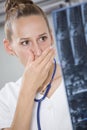 Shocked doctor with x-ray scans Royalty Free Stock Photo
