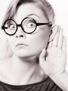 Shocked girl eavesdropping. Royalty Free Stock Photo