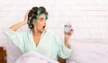 Shocked Girl Looking At Alarm Clock Sitting In Bedroom Royalty Free Stock Photo