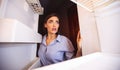 Shocked girl looking at her empty fridge shelves in despair Royalty Free Stock Photo