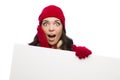 Shocked Girl Wearing Winter Hat and Gloves Holds Blank Sign Royalty Free Stock Photo