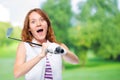 Shocked golfer looking behind the trajectory of a ball flying Royalty Free Stock Photo