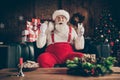 Shocked grey beard santa claus sit cozy couch watch x-mas christmas cinema film impressed drink milk glass eat