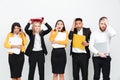 Shocked group of colleagues standing isolated in office. Royalty Free Stock Photo