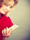 Shocked heartbroken woman looking at her phone Royalty Free Stock Photo