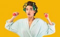 Shocked Housewife Exercising With Dumbbells Training At Home, Yellow Background Royalty Free Stock Photo