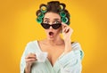 Shocked Housewife Looking At Camera Above Sunglasses Holding Coffee, Studio Royalty Free Stock Photo