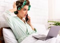 Shocked Housewife Talking On Phone Browsing Internet Lying In Bed Royalty Free Stock Photo