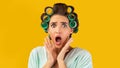 Shocked Housewife Touching Face Looking At Camera, Yellow Background, Panorama
