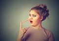 Shocked liar woman with long nose Royalty Free Stock Photo