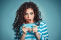 Shocked look at phone. Closeup portrait surprised young girl looking at phone seeing bad news or photos with stunned emotion on Royalty Free Stock Photo