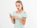 Shocked look at phone, portrait surprised young girl,woman looking at smartphone seeing bad news or photos with stunned emotion on