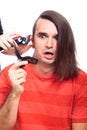 Shocked man being shaved with hair trimmer