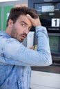 shocked man counting money with gasoline refueling car Royalty Free Stock Photo