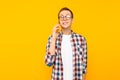 Shocked man talking on the phone, on a yellow background Royalty Free Stock Photo