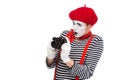 shocked mime taking photo with film camera