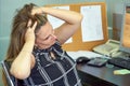 Woman in stress in front of computer Royalty Free Stock Photo