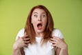 Shocked panicking redhead middle-aged woman gasping drop jaw open mouth stare camera freak-out anxious pointing herself