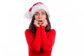 Shocked panicking woman in red christmas Santa hat hear mind-blowing news, look worried and shocked, stare camera stand