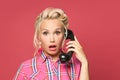 Shocked pinup woman phone on red background Royalty Free Stock Photo