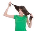 Shocked and sad woman - broken hair after coloration. Royalty Free Stock Photo