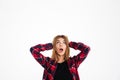 Shocked screaming young woman looking aside. Royalty Free Stock Photo