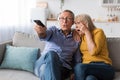 Shocked Senior Couple Watching Horror Movie Switching Channels At Home Royalty Free Stock Photo