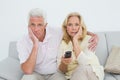 Shocked senior couple watching television Royalty Free Stock Photo