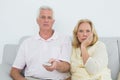 Shocked senior couple watching television Royalty Free Stock Photo