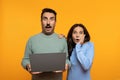 Shocked senior european husband and wife with laptop, with open mouth