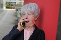 Shocked senior woman listening to some rumors Royalty Free Stock Photo
